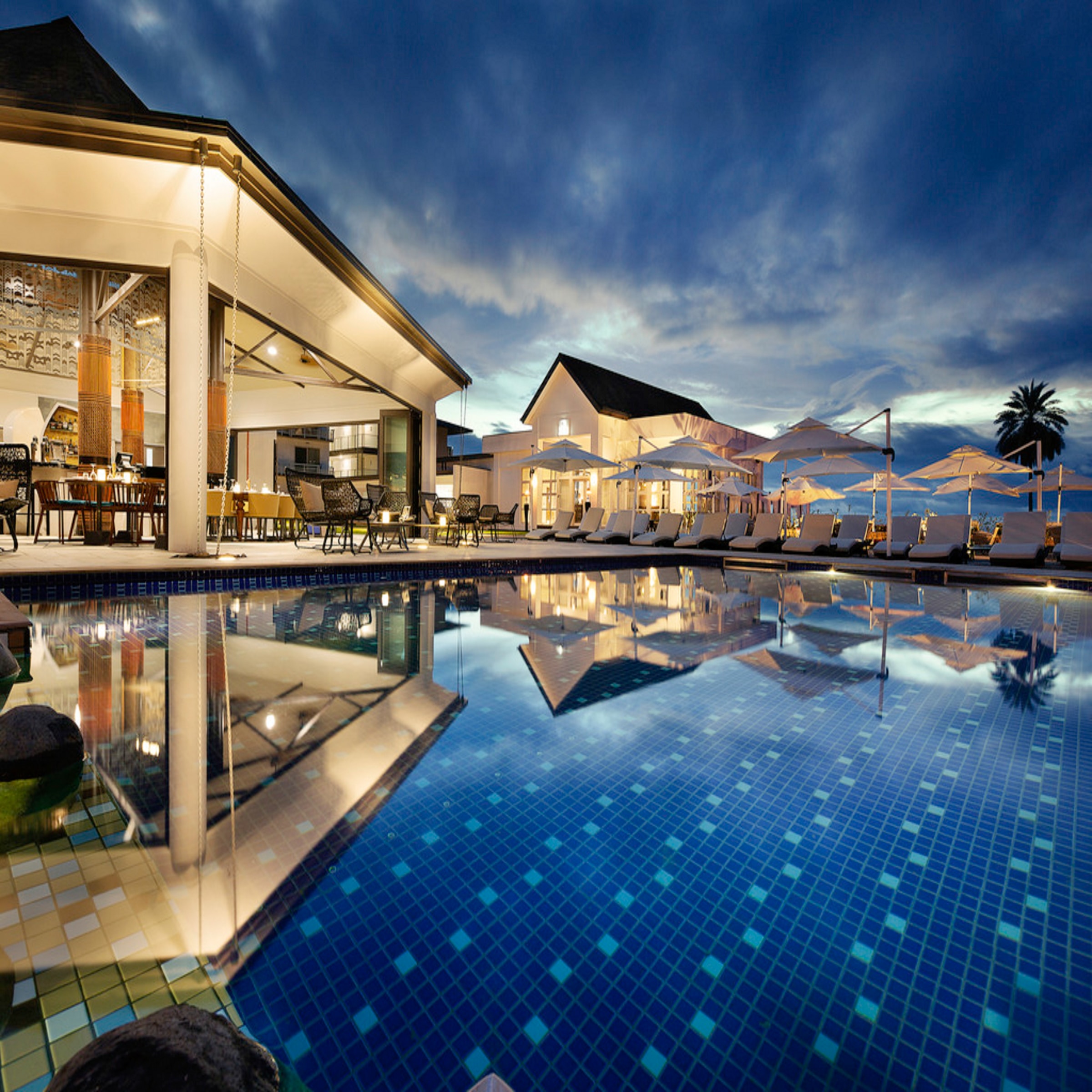 blue outdoor pool with lights