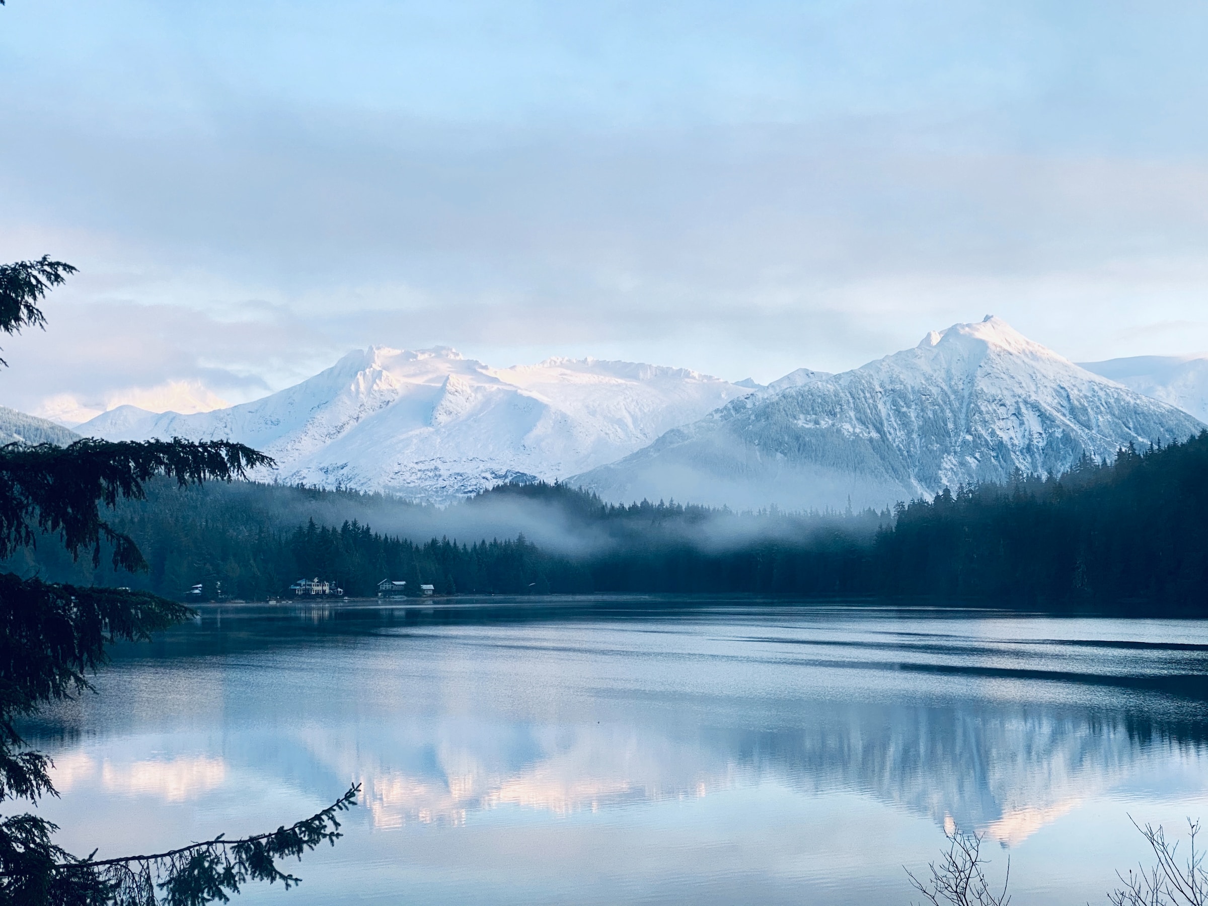 white mountains near lake